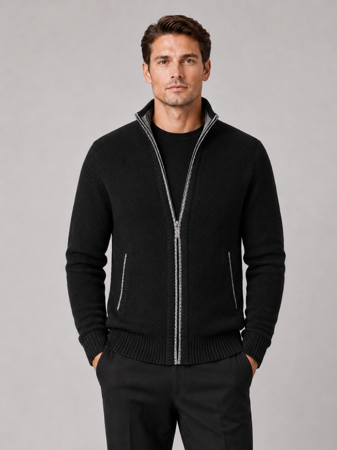Man styling black fleece cardigan sweater in a modern everyday winter lifestyle outfit