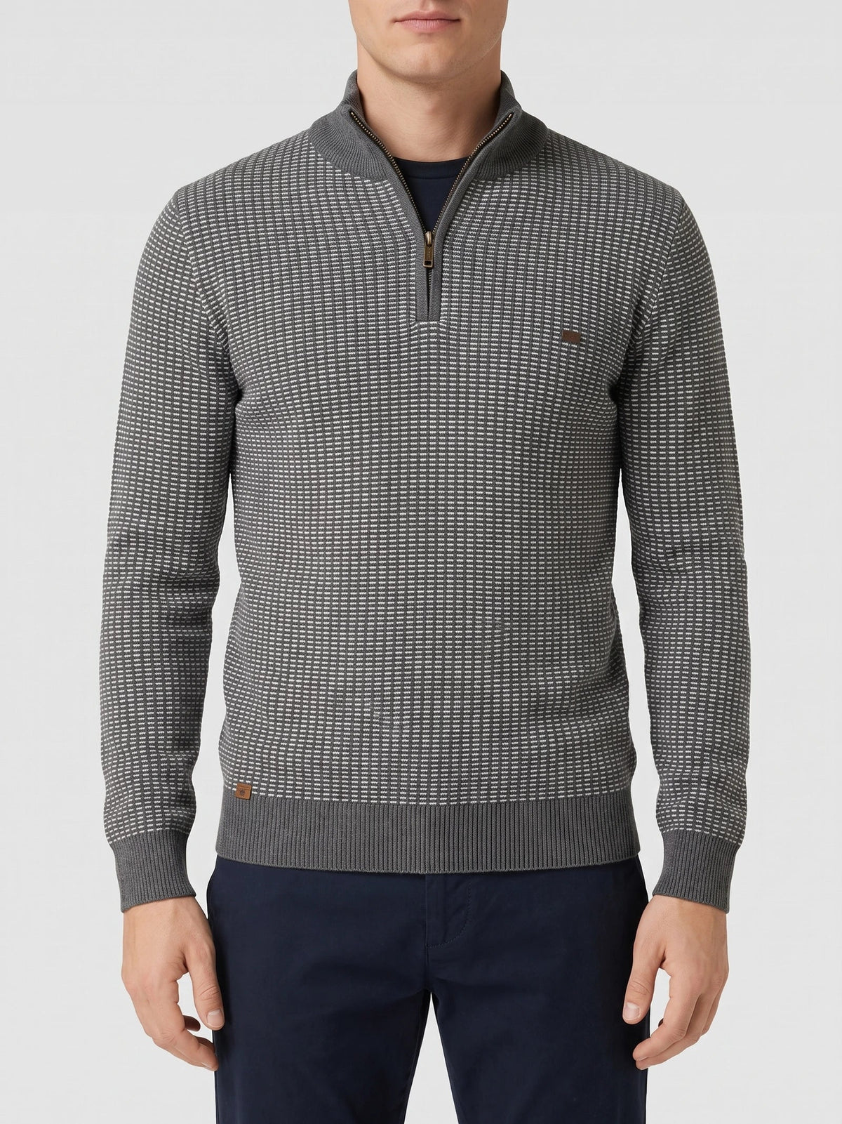Model wearing a Brown knit quarter zip sweater with a textured knit pattern and ribbed mock neck in a front studio view.