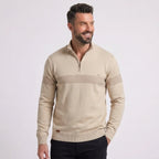 Man wearing MannerCo navy half-zip sweater slim fit in indoor lifestyle setting