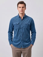 Rear studio view of a model wearing a Gray Twill Tweed Shirt, showing the back yoke, long sleeves, and curved hem.