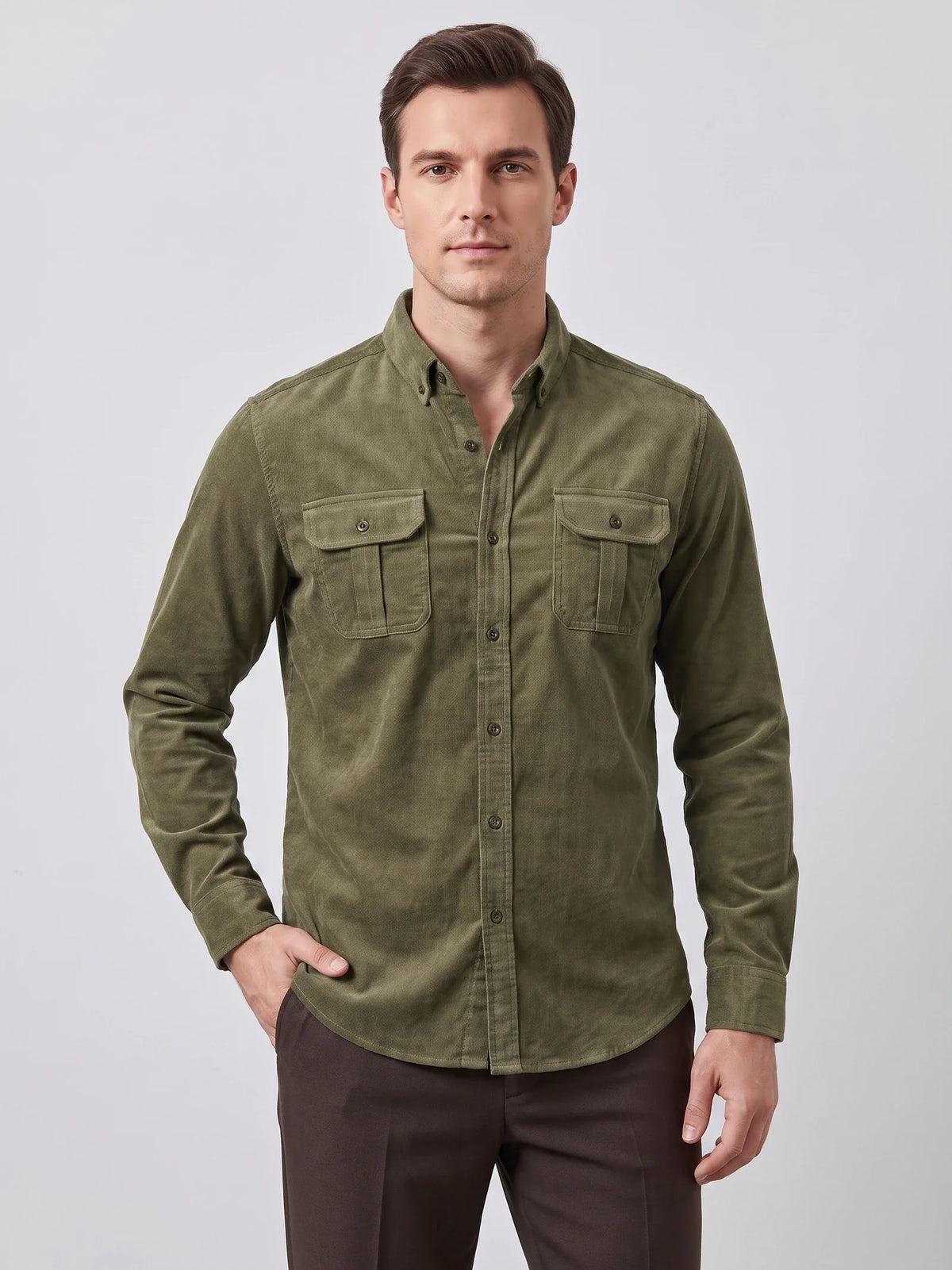 Model wearing a Navy Twill Tweed Shirt with rolled sleeves and flap chest pockets while walking beside a landscaped home.
