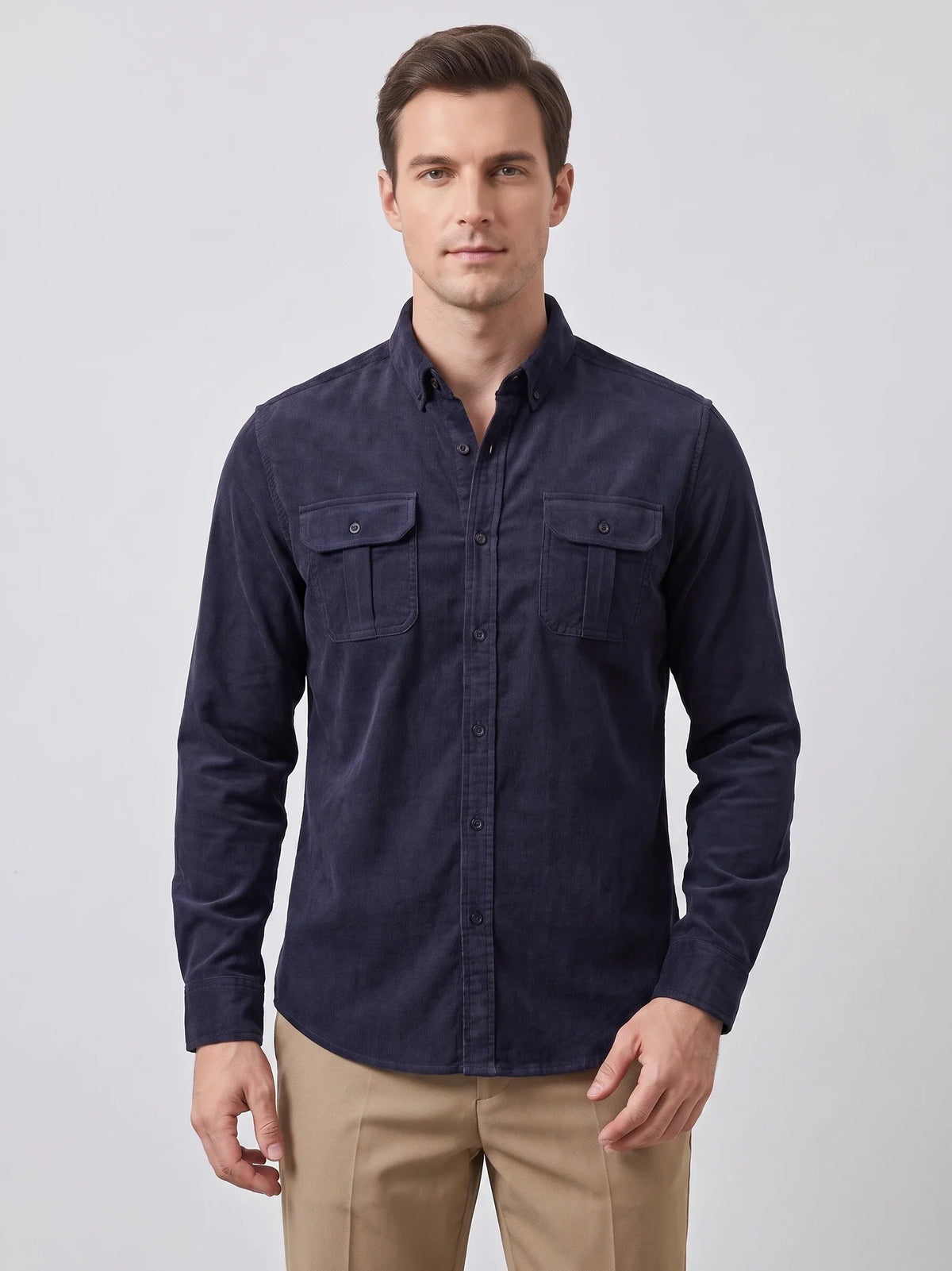 Close-up of the Blue Twill Tweed Shirt showing its ribbed cotton texture, pointed collar, button placket, and flap chest pocket.